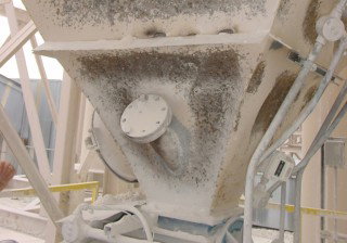 Preventing silo and hopper obstructions at cement plants