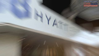 Motion-blurred Hyatt Regency Paris hotel signage with the Cemtech logo.